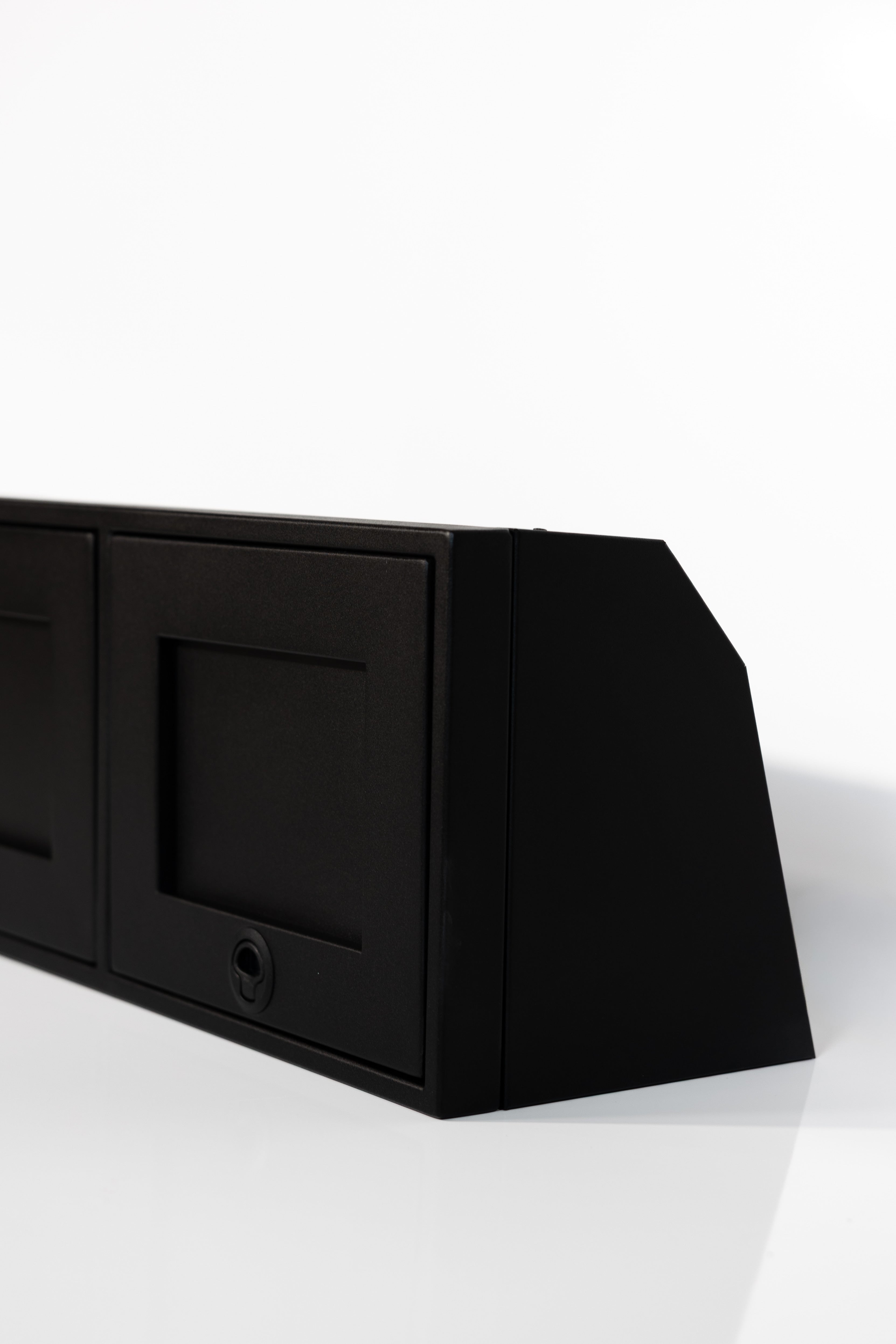 Black 36-inch wide aluminum angled upper Van Wife Components cabinet with two shaker-style doors & flush slam latches