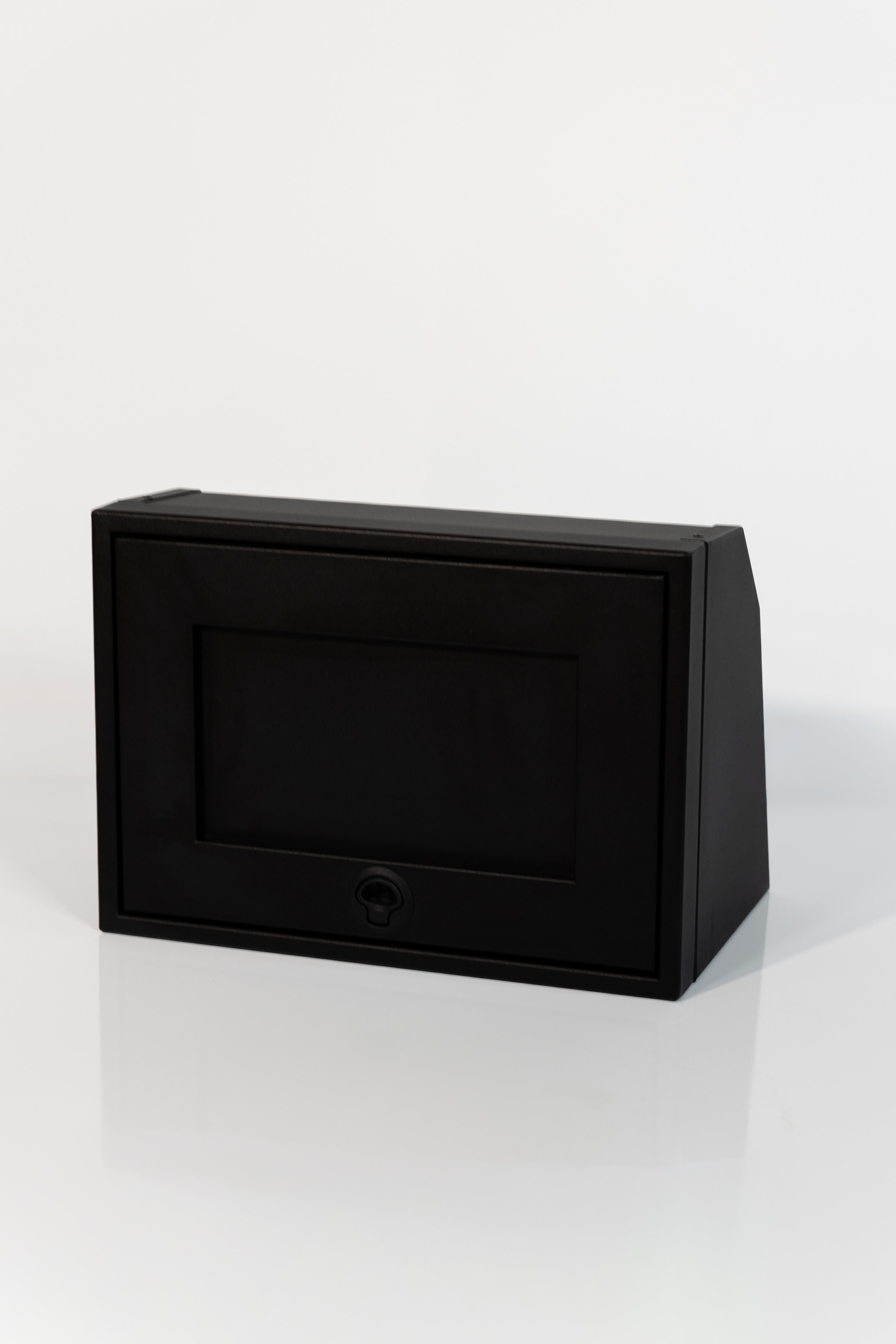 Black 21-inch wide aluminum angled upper Van Wife Components cabinet with a single shaker-style door & flush slam latch