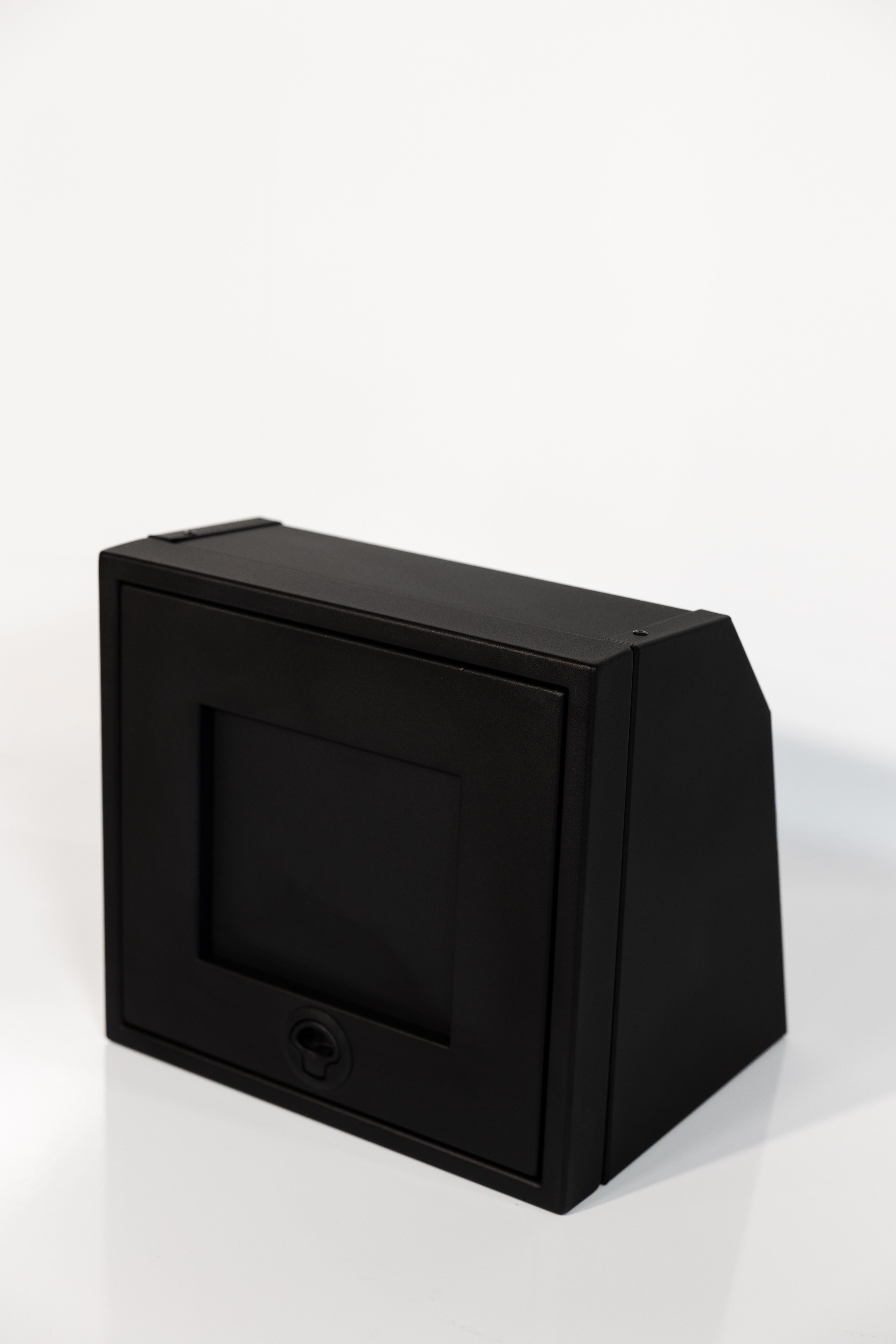 Black 16-inch wide aluminum angled upper Van Wife Components cabinet with a single shaker-style door & flush slam latch