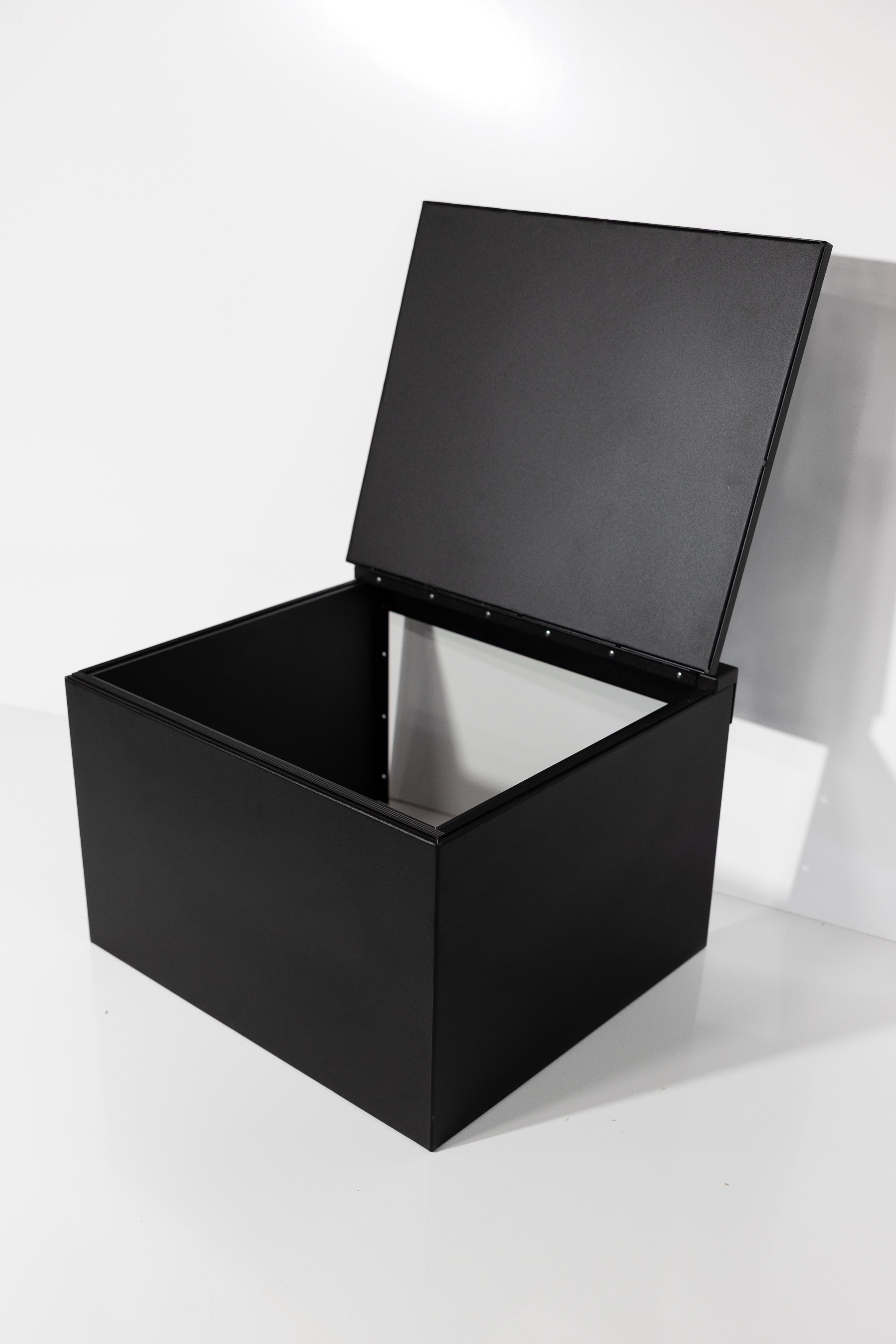 Black 24" x 22” x 16” aluminum storage bench with flip-top lid