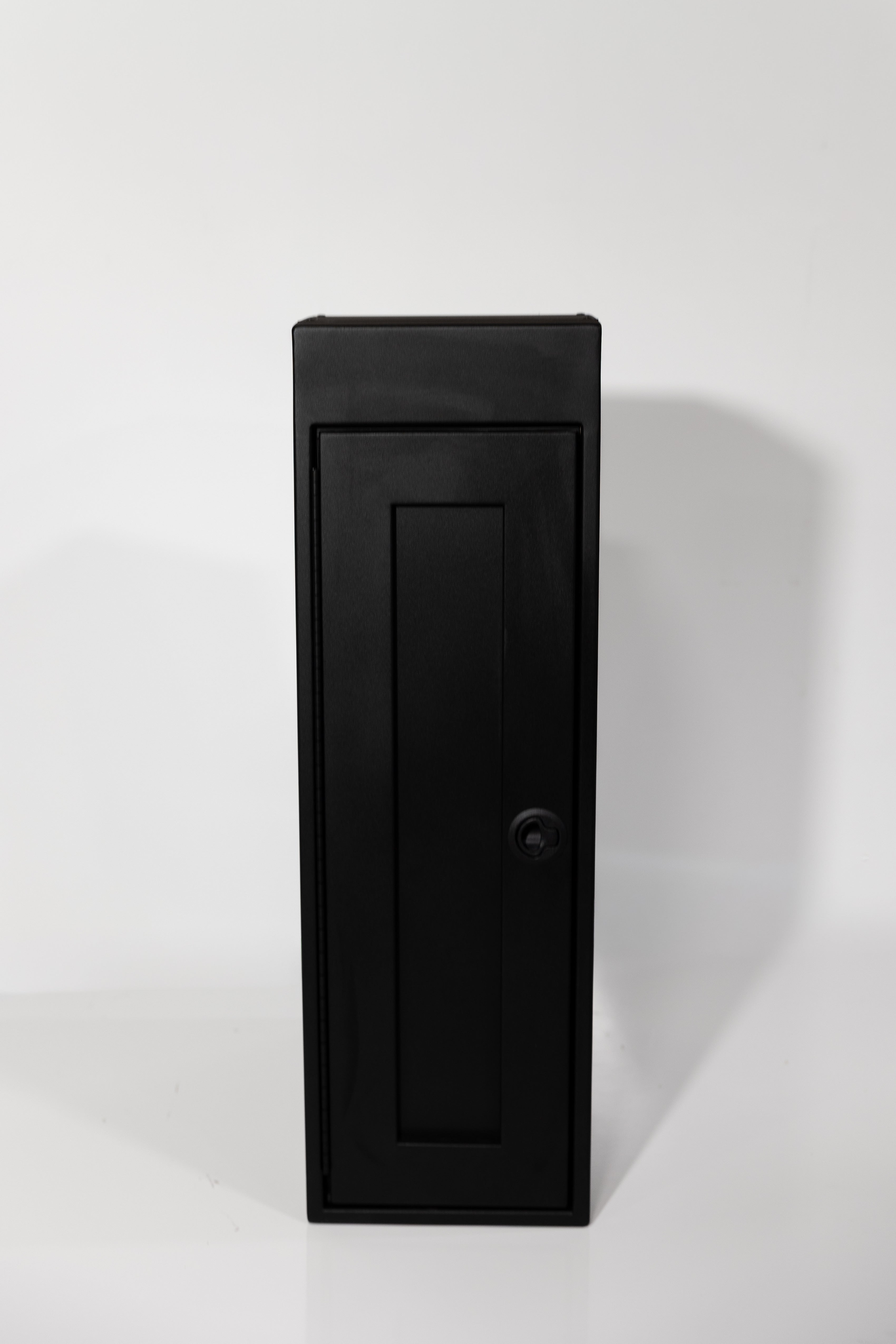Black 12-inch wide vertical aluminum upper van closet showing a single shaker-style door with flush slam latch