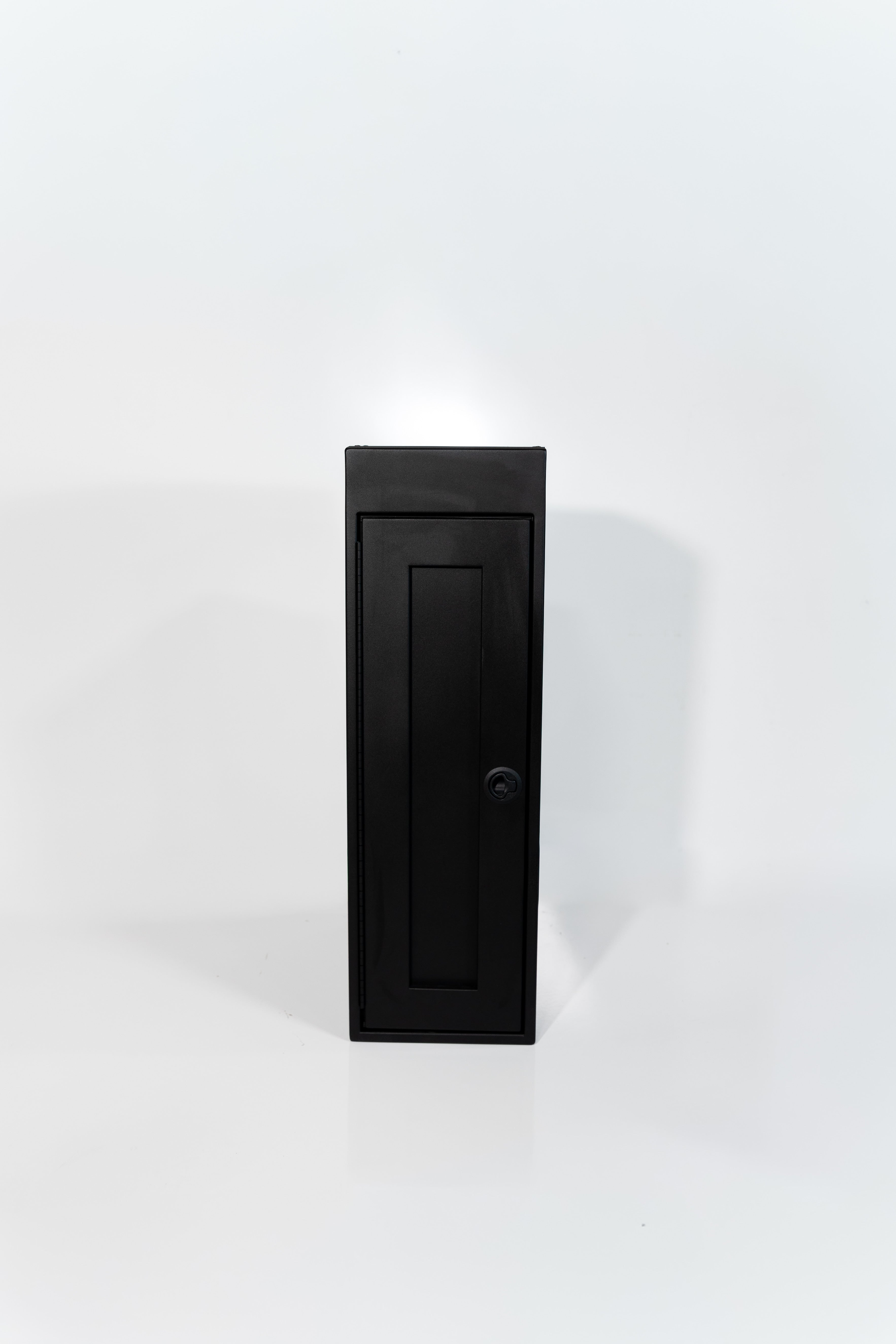 Black 12-inch wide vertical aluminum upper van closet showing a single shaker-style door with flush slam latch