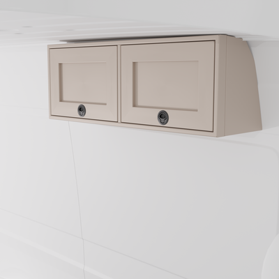 Sandstone 42-inch wide aluminum angled upper Van Wife Components cabinet with two shaker-style doors & flush slam latches mounted in a van
