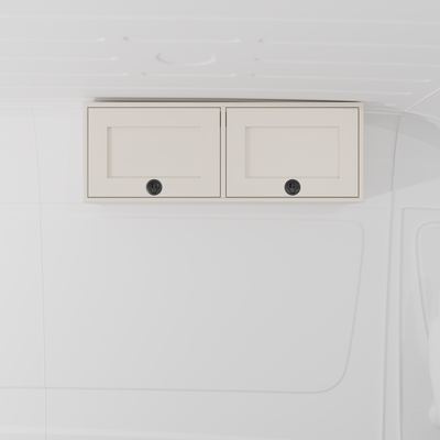 White 42-inch wide aluminum angled upper Van Wife Components cabinet with two shaker-style doors & flush slam latches mounted in a van

