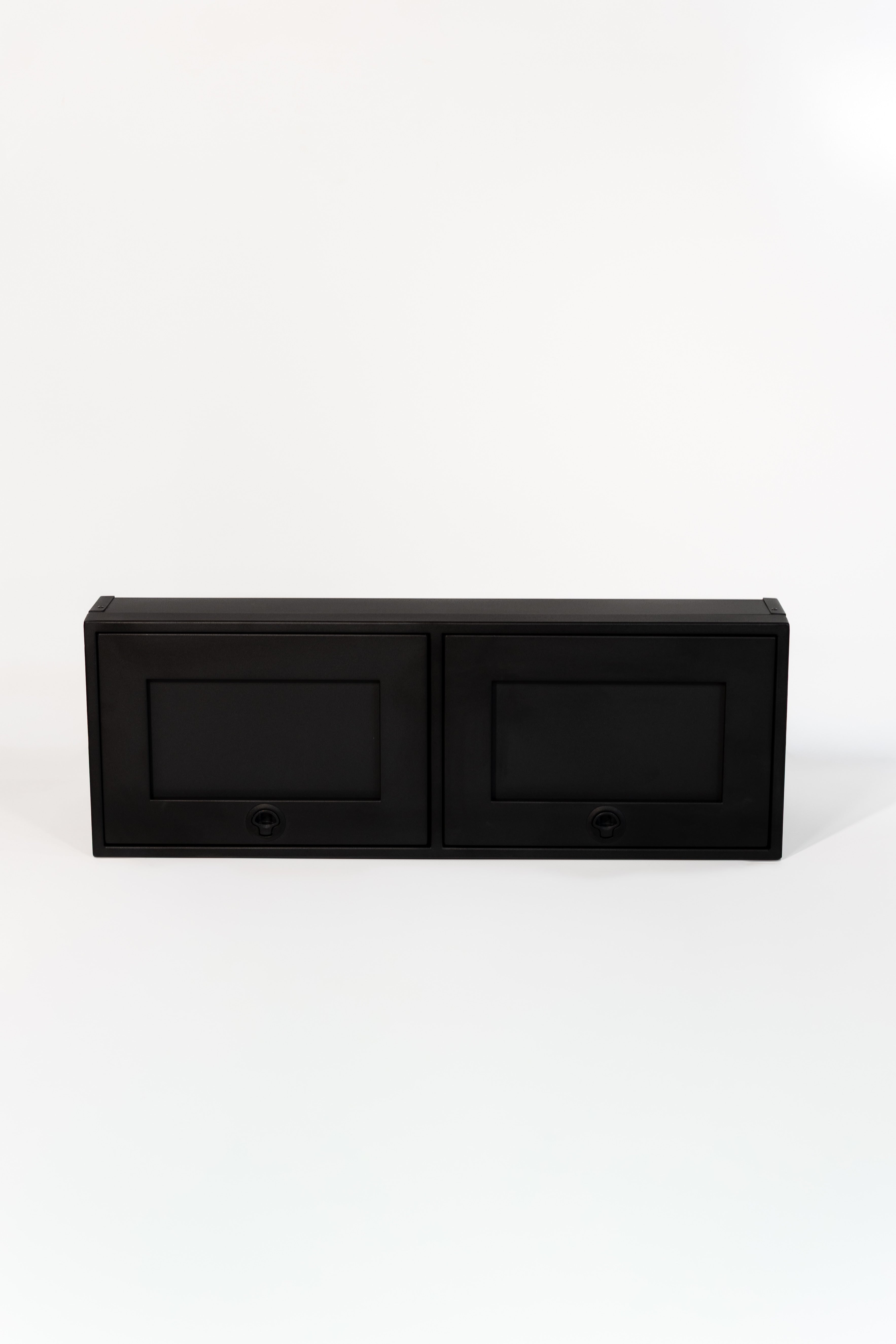 Black 42-inch wide aluminum angled upper Van Wife Components cabinet with two shaker-style doors & flush slam latches