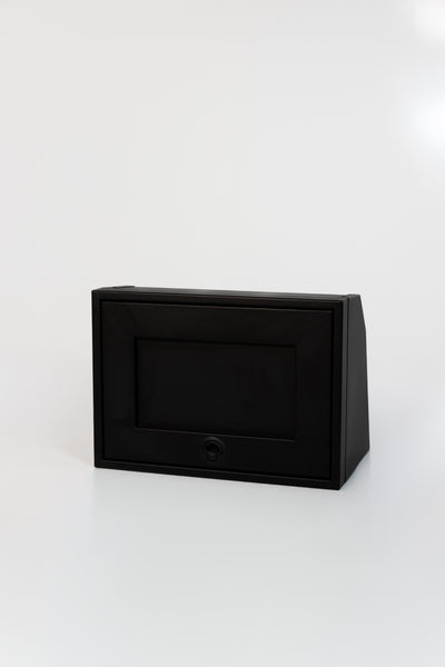 Black 21-inch wide aluminum angled upper Van Wife Components cabinet with a single shaker-style door & flush slam latch 