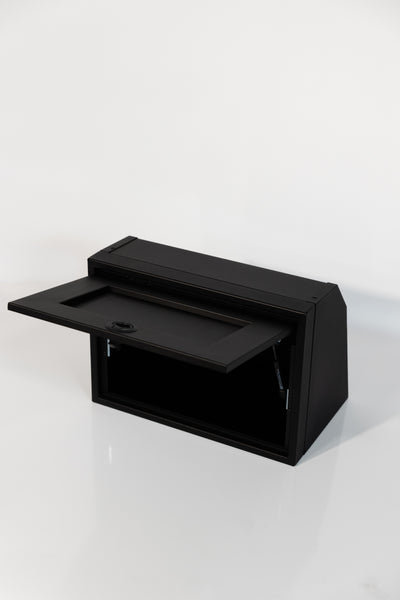 Black 21-inch wide aluminum angled upper Van Wife Components cabinet with a single shaker-style door & flush slam latch 