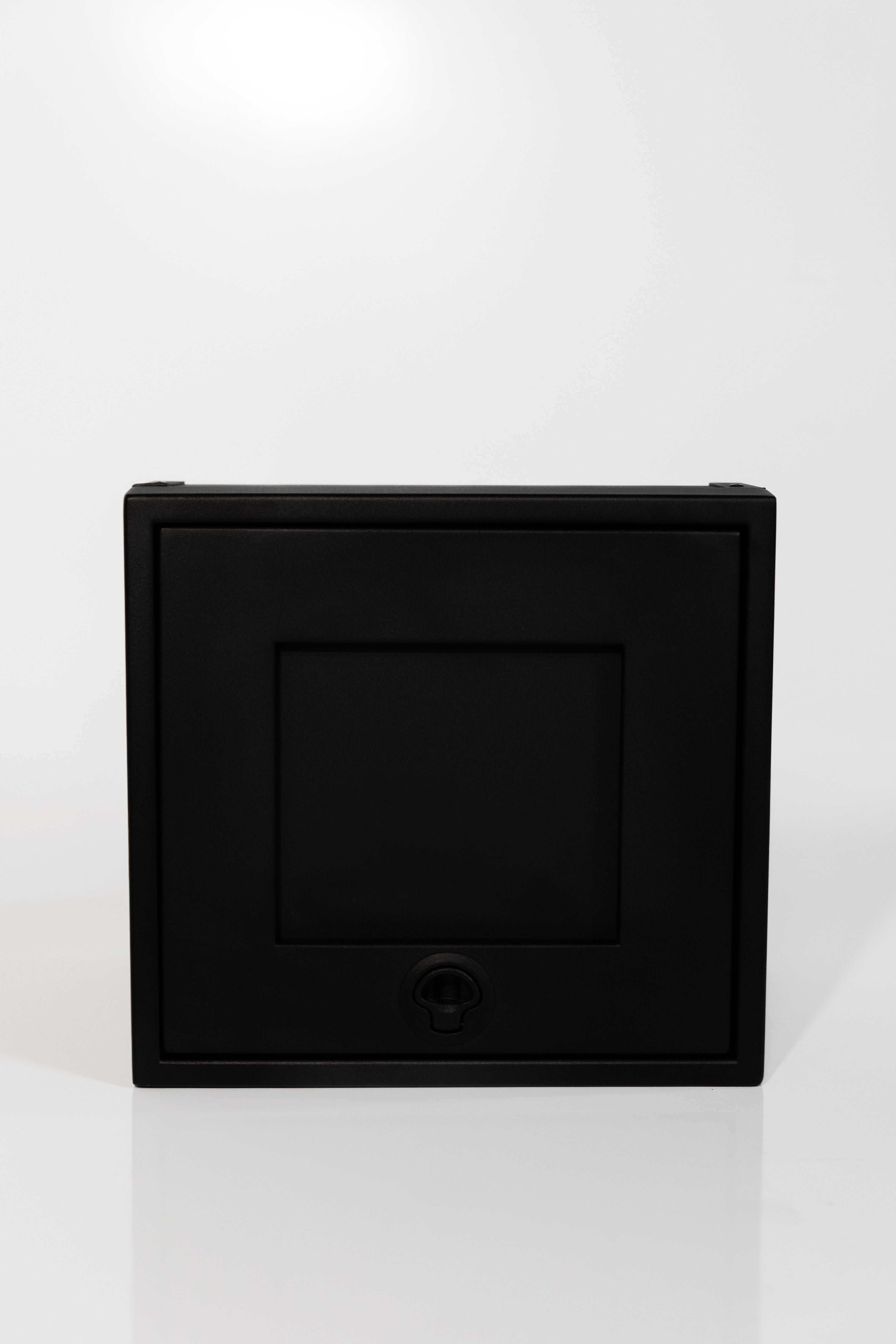 Black 16-inch wide aluminum angled upper Van Wife Components cabinet with a single shaker-style door & flush slam latch 