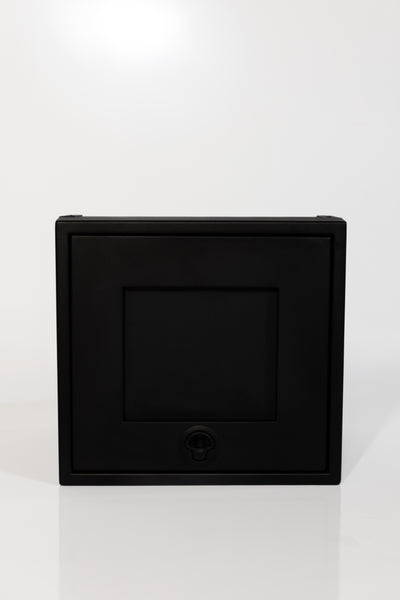 Black 16-inch wide aluminum angled upper Van Wife Components cabinet with a single shaker-style door & flush slam latch 