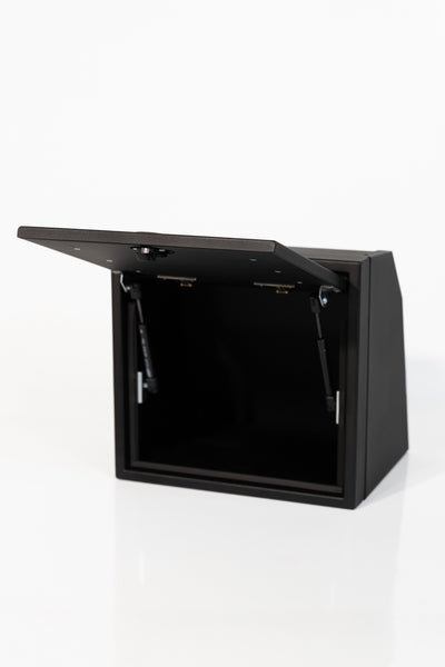 Black 16-inch wide aluminum angled upper Van Wife Components cabinet with a single shaker-style door & flush slam latch 