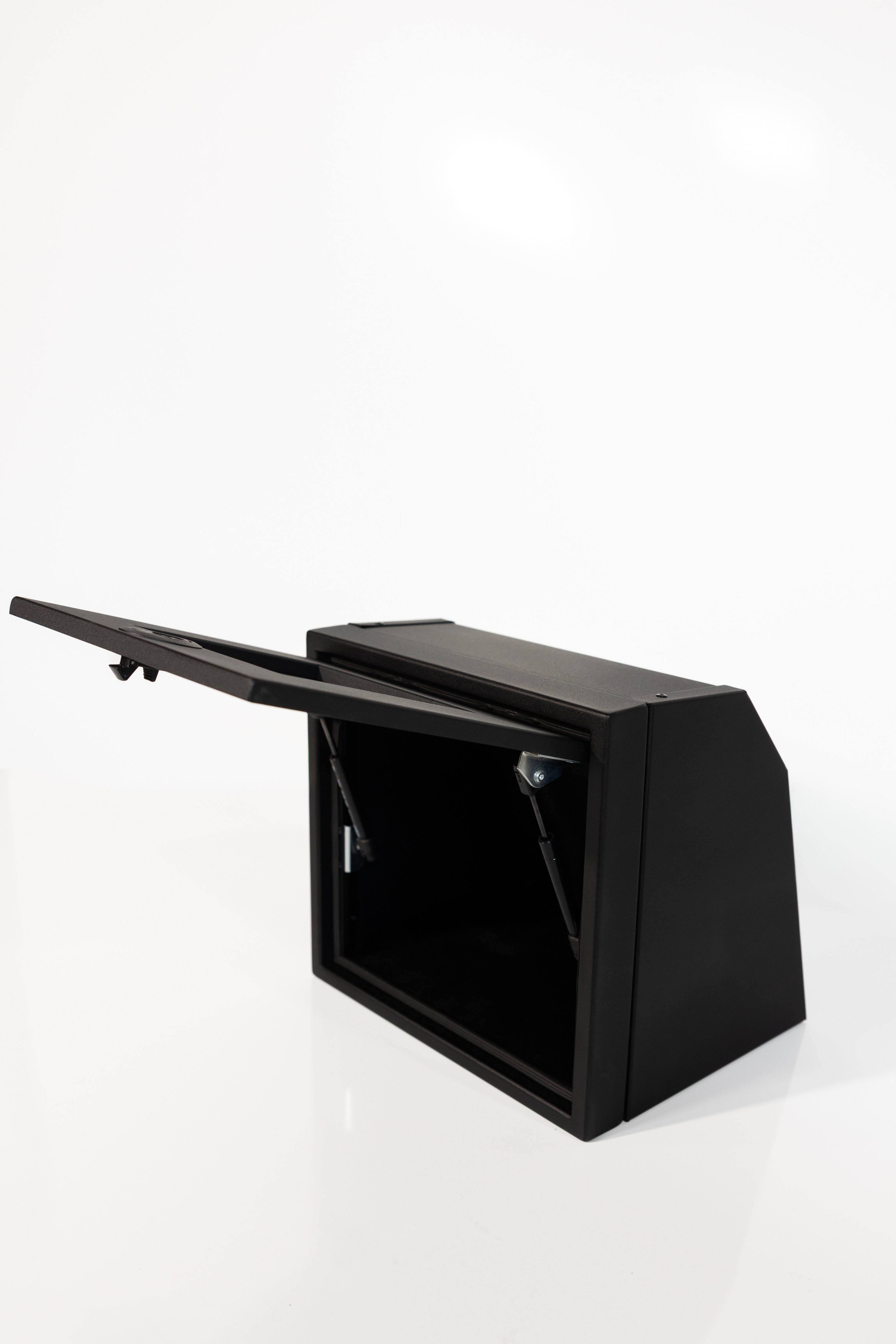 Black 16-inch wide aluminum angled upper Van Wife Components cabinet with a single shaker-style door & flush slam latch 