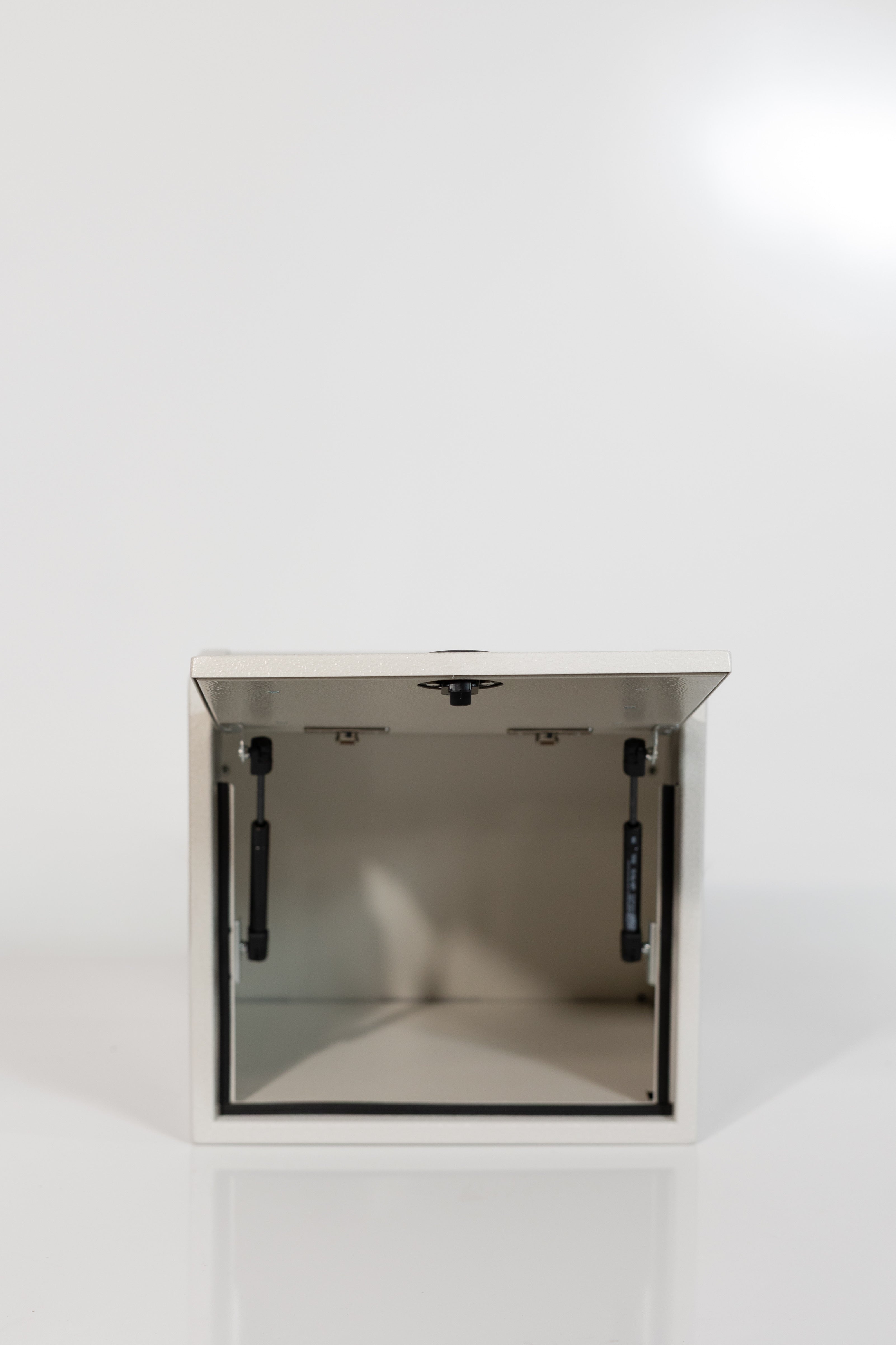 Sandstone 16-inch wide aluminum angled upper Van Wife Components cabinet with a single shaker-style door & flush slam latch 