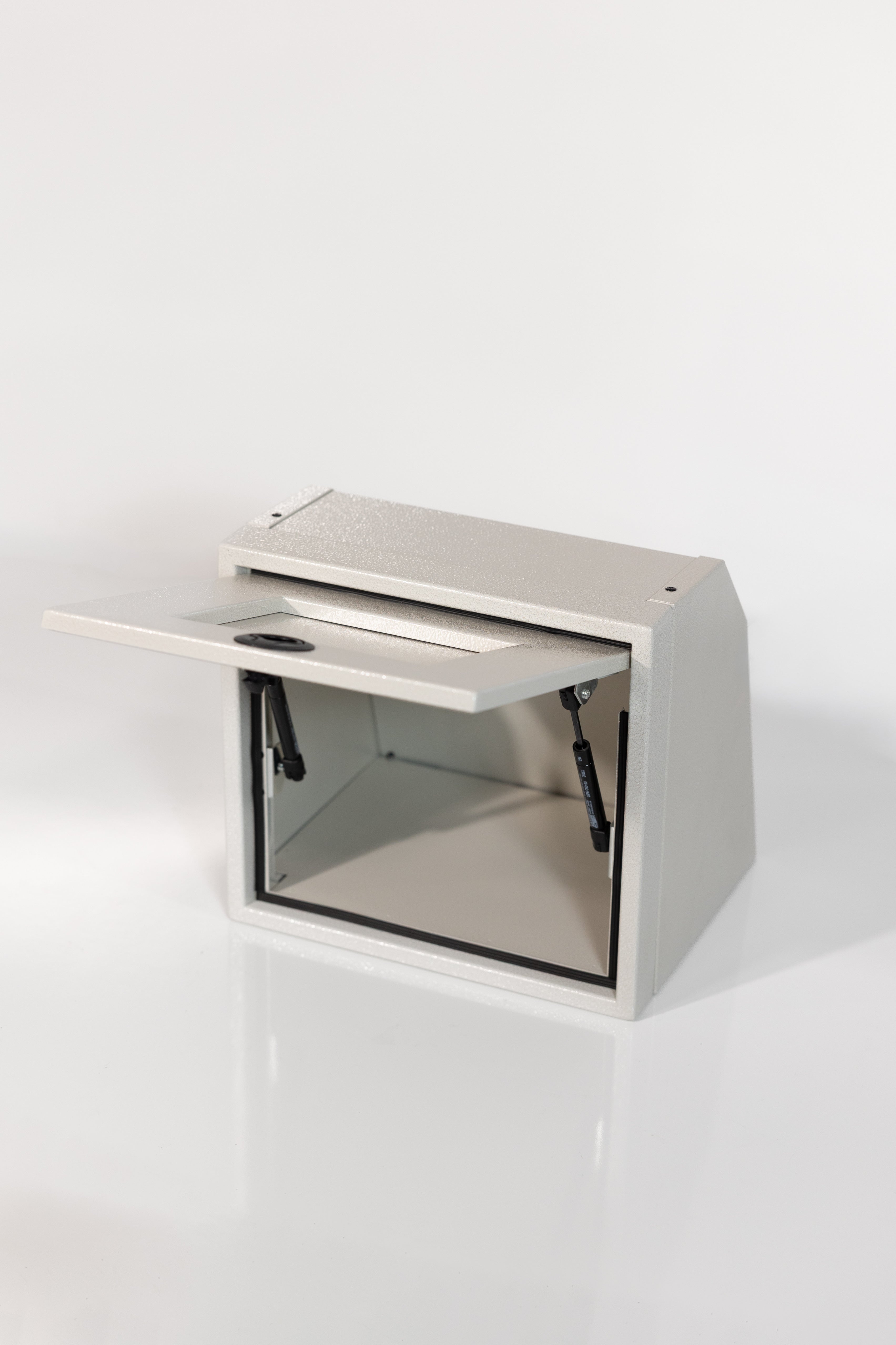 Sandstone 16-inch wide aluminum angled upper Van Wife Components cabinet with a single shaker-style door & flush slam latch 