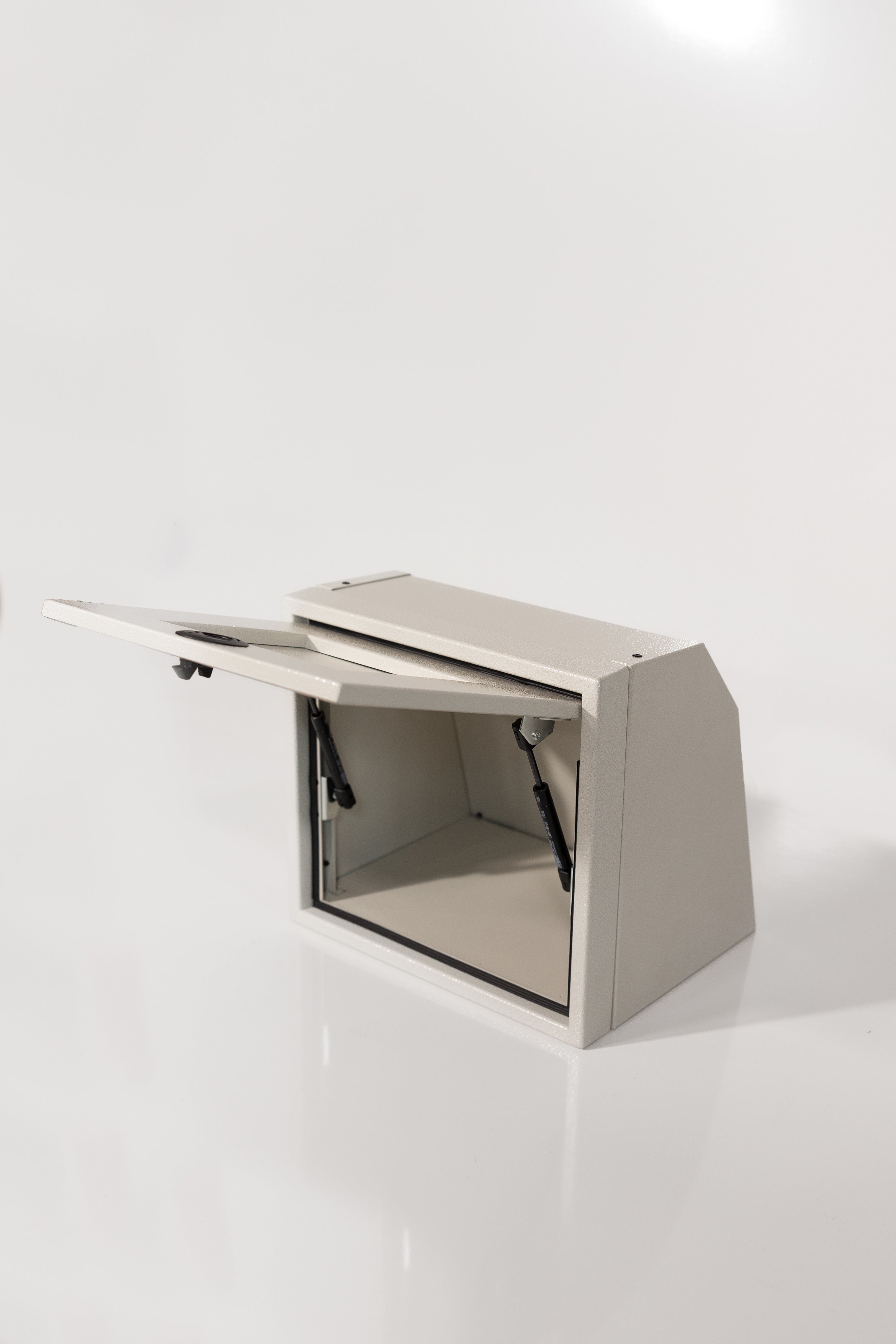 Sandstone 16-inch wide aluminum angled upper Van Wife Components cabinet with a single shaker-style door & flush slam latch 