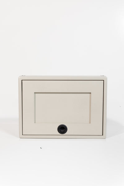 Sandstone 21-inch wide aluminum angled upper Van Wife Components cabinet with a single shaker-style door & flush slam latch 