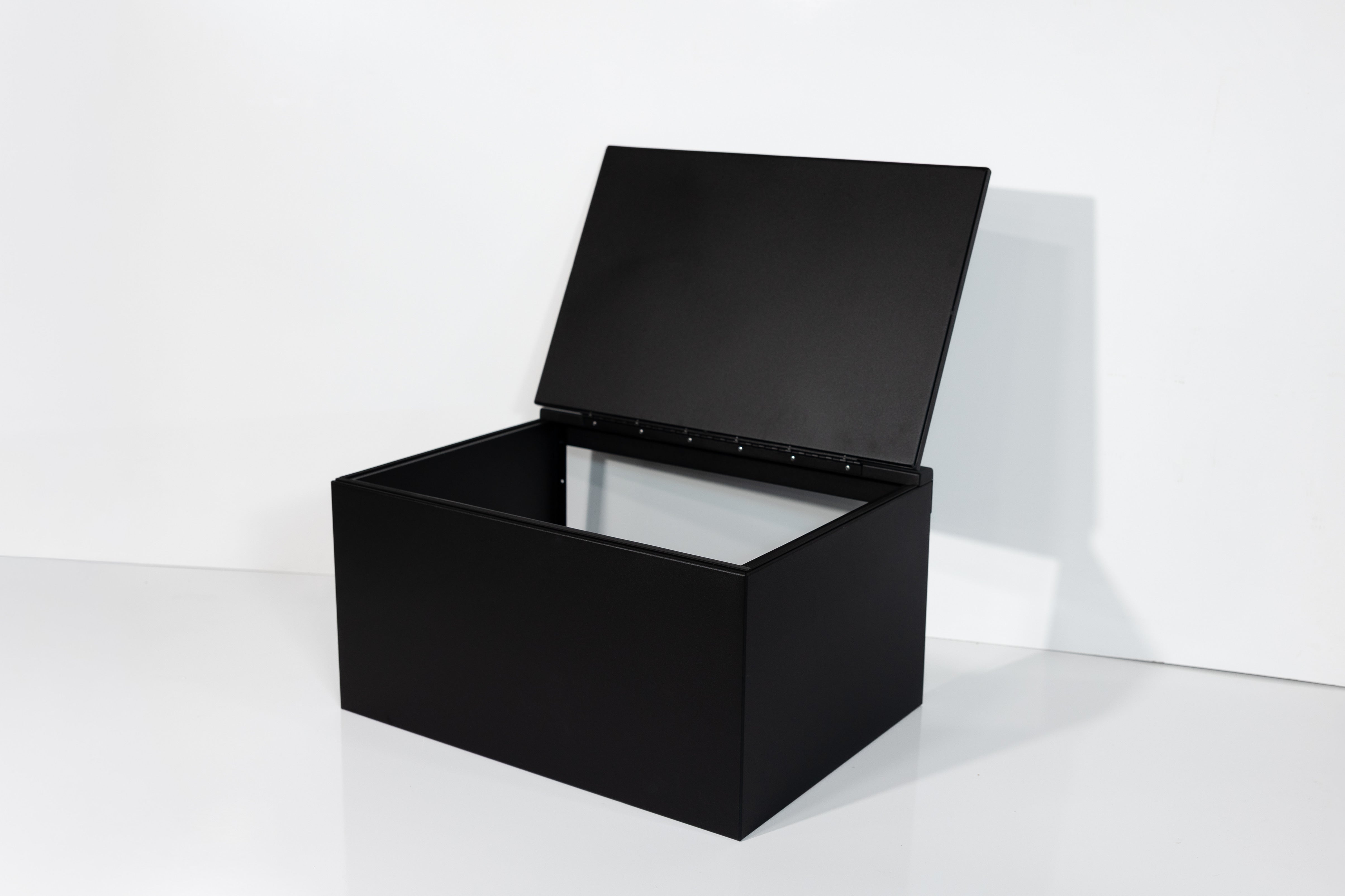 Black 30" x 22” x 16” aluminum storage bench with flip-top lid 
