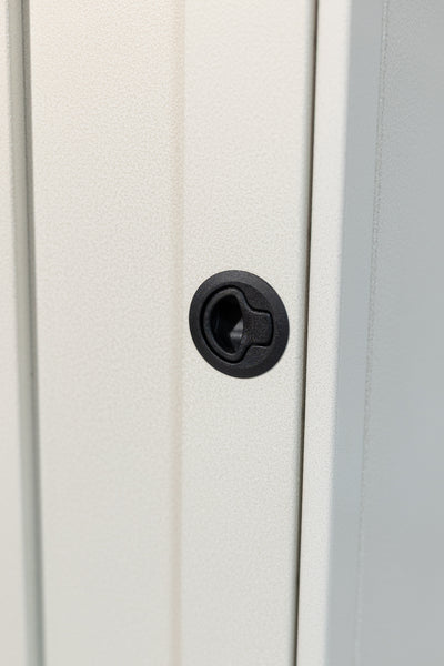 White 12-inch wide vertical aluminum upper van closet showing a single shaker-style door with flush slam latch 