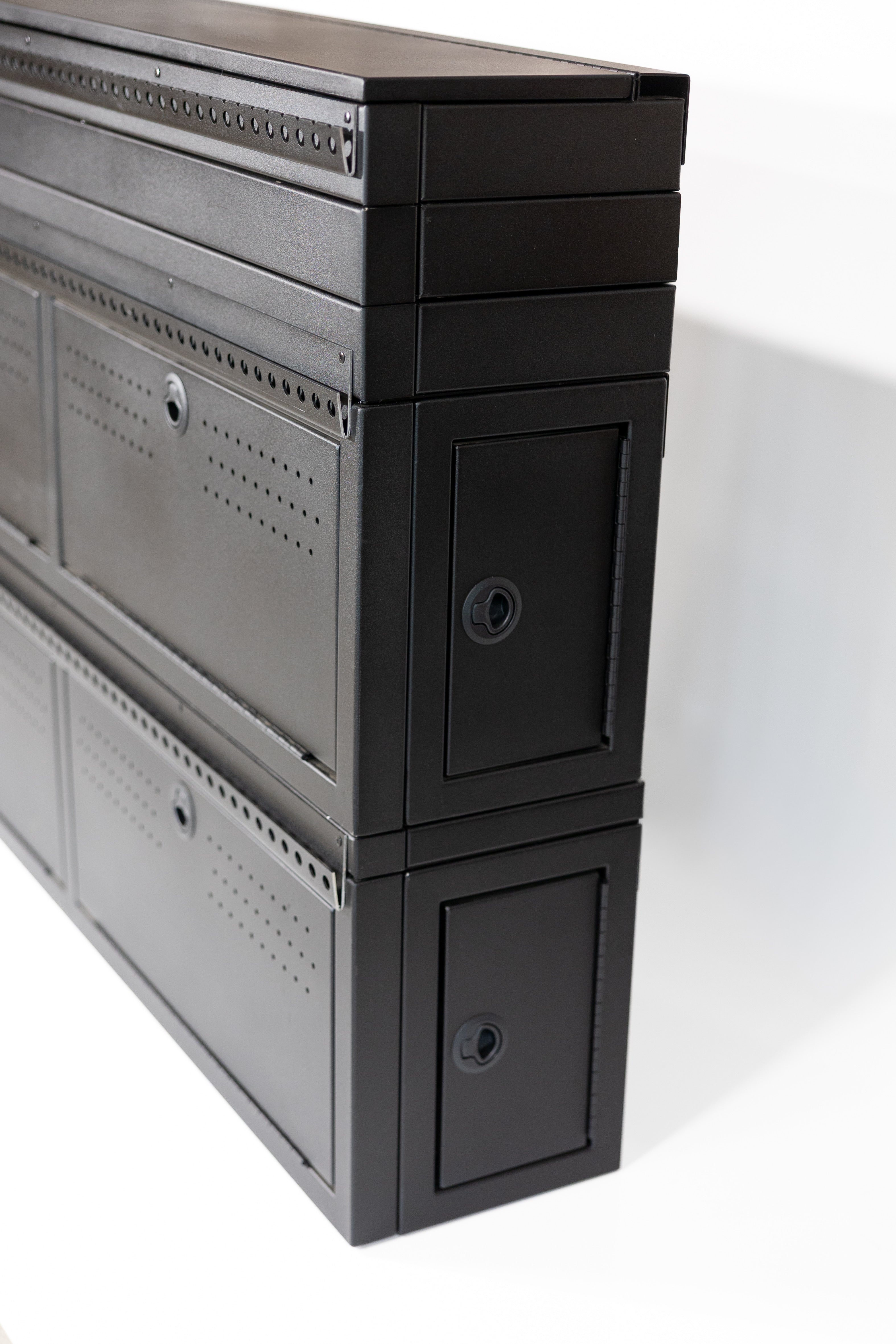Fully assembled Black 12" wheel well covers - Stacked 2 levels high with optional risers, paired with hinged lid for a complete, finished look.
