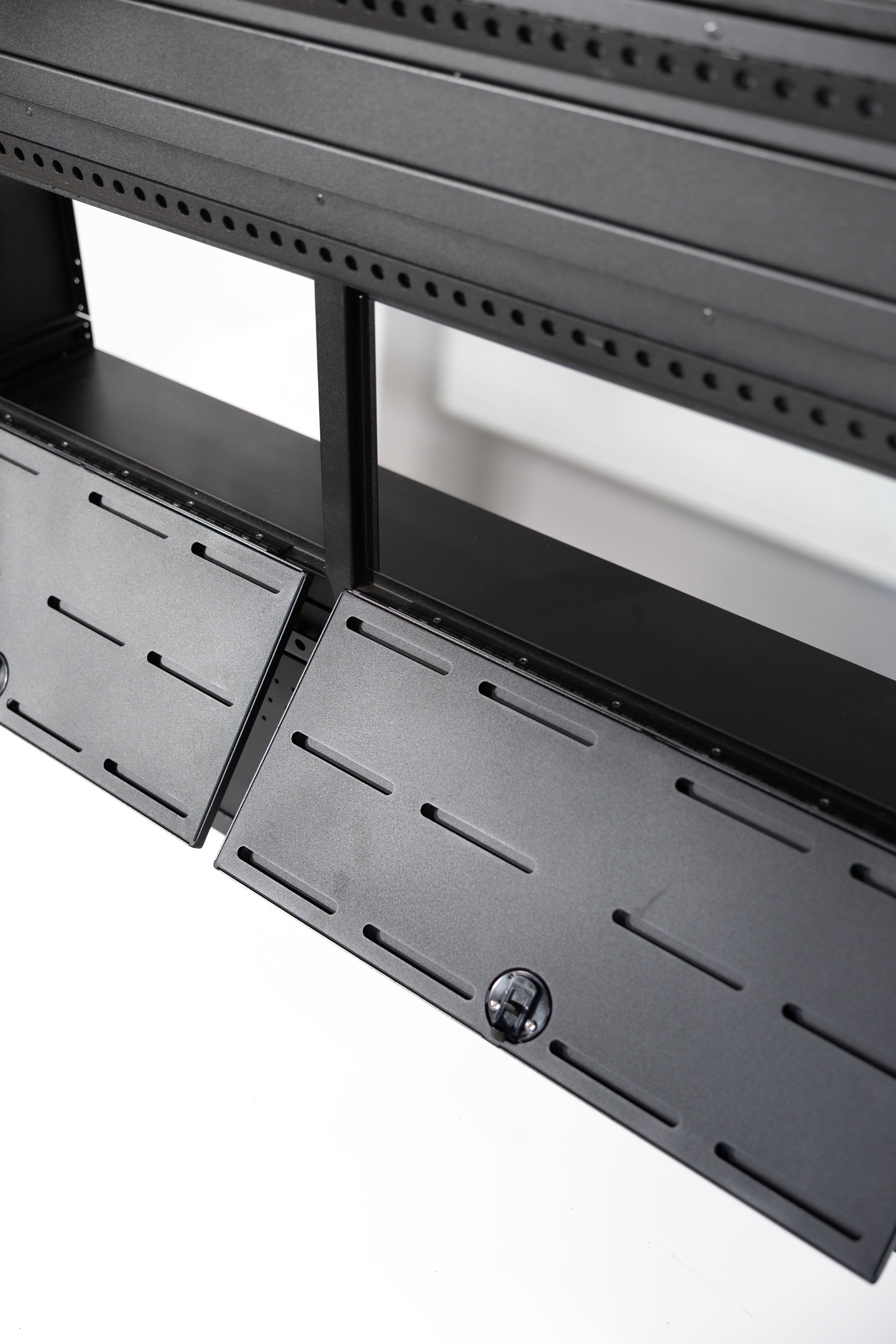 Fully assembled Black 12" wheel well covers - Stacked 2 levels high with optional risers, divider shelf, paired with hinged lid for a complete, finished look.
